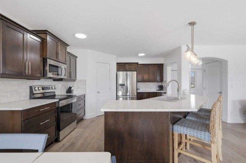 13 Hendrickson Bay, Sylvan Lake, AB - Indoor Photo Showing Kitchen With Upgraded Kitchen