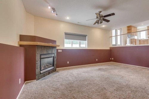 82 Ruttan Close, Red Deer, AB - Indoor Photo Showing Other Room With Fireplace