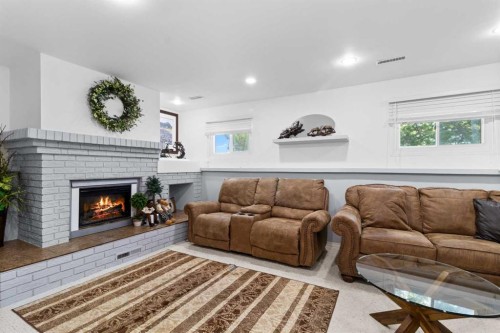 45 Sylvan Drive, Sylvan Lake, AB - Indoor Photo Showing Living Room With Fireplace