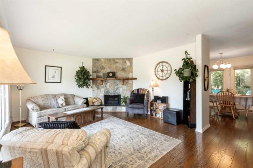 4003 53 Avenue, Innisfail, AB - Indoor Photo Showing Living Room With Fireplace