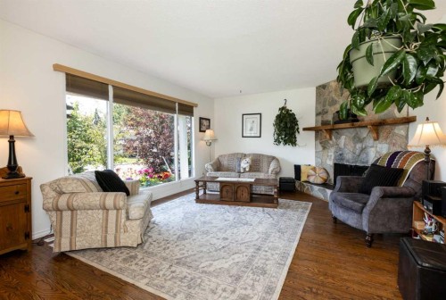 4003 53 Avenue, Innisfail, AB - Indoor Photo Showing Living Room With Fireplace