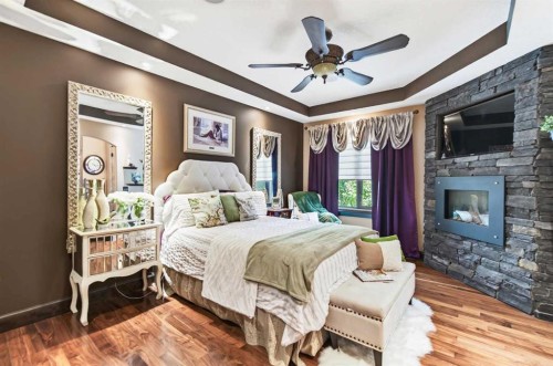 6297 Cronquist Drive, Red Deer, AB - Indoor Photo Showing Bedroom With Fireplace