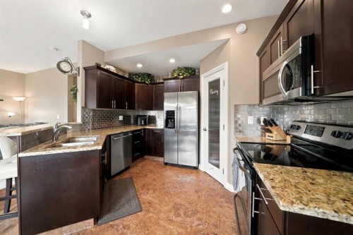 133 Portway Close, Blackfalds, AB - Indoor Photo Showing Kitchen With Stainless Steel Kitchen With Double Sink With Upgraded Kitchen
