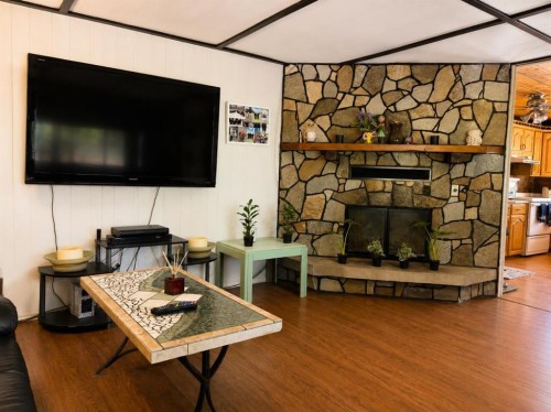 5220 44 Street, Consort, AB - Indoor Photo Showing Living Room With Fireplace
