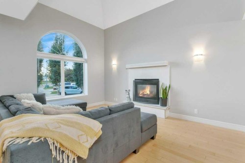 13 Fern Crescent, Sylvan Lake, AB - Indoor Photo Showing Living Room With Fireplace