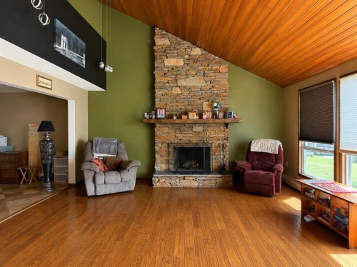 5216 47 Street, Consort, AB - Indoor Photo Showing Living Room With Fireplace