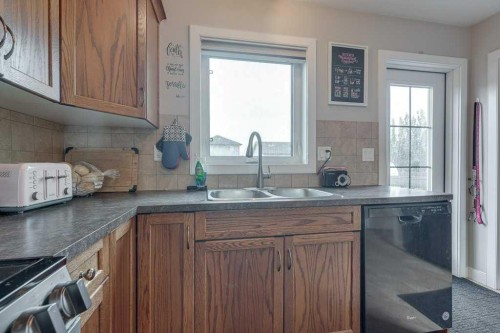 183 Kelloway Crescent, Red Deer, AB - Indoor Photo Showing Kitchen With Double Sink