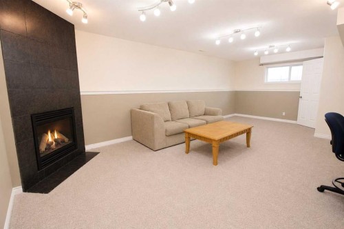 96 Duckering Close, Red Deer, AB - Indoor With Fireplace