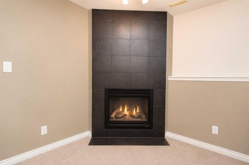 96 Duckering Close, Red Deer, AB - Indoor With Fireplace