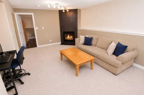 96 Duckering Close, Red Deer, AB - Indoor Photo Showing Living Room With Fireplace