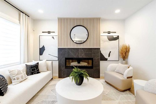 190 Rosemary Gardens Se, Calgary, AB - Indoor Photo Showing Living Room With Fireplace