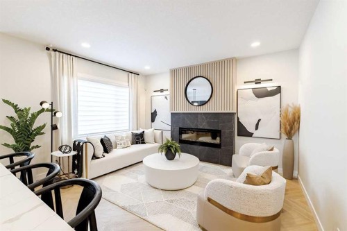 190 Rosemary Gardens Se, Calgary, AB - Indoor Photo Showing Living Room With Fireplace