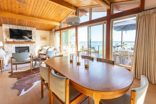 391 Birchcliff Road, Birchcliff, AB - Indoor Photo Showing Dining Room With Fireplace
