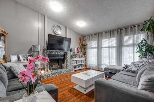 50 Grant Street, Red Deer, AB - Indoor Photo Showing Living Room With Fireplace
