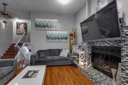 50 Grant Street, Red Deer, AB - Indoor Photo Showing Living Room With Fireplace