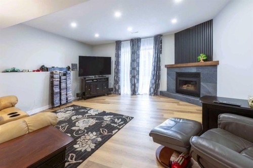 19 Royal Crescent, Lacombe, AB - Indoor With Fireplace