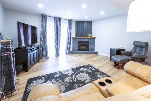 19 Royal Crescent, Lacombe, AB - Indoor Photo Showing Living Room With Fireplace