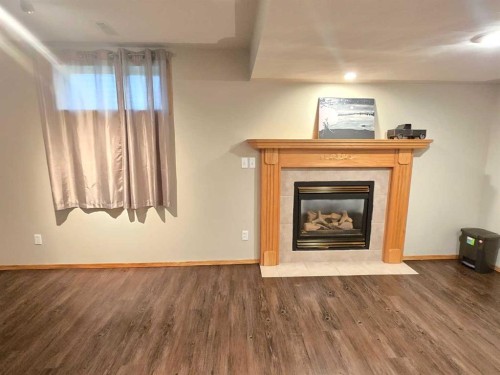 12 Archibald Crescent, Red Deer, AB - Indoor Photo Showing Living Room With Fireplace