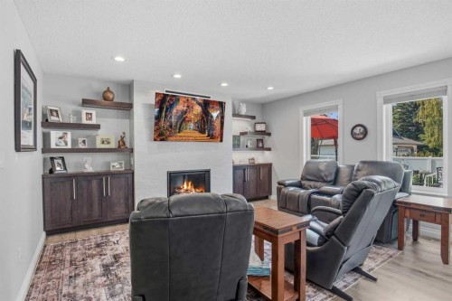 5933 45 Street Crescent, Innisfail, AB - Indoor Photo Showing Living Room With Fireplace