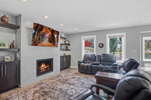 5933 45 Street Crescent, Innisfail, AB - Indoor Photo Showing Living Room With Fireplace