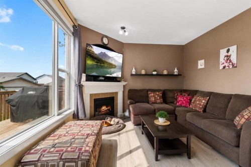 5 Lambertson Place, Sylvan Lake, AB - Indoor Photo Showing Living Room With Fireplace