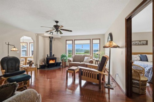 6026 47 Street, Innisfail, AB - Indoor Photo Showing Living Room With Fireplace