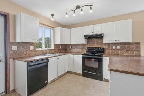 36 Keen Crescent, Red Deer, AB - Indoor Photo Showing Kitchen With Double Sink
