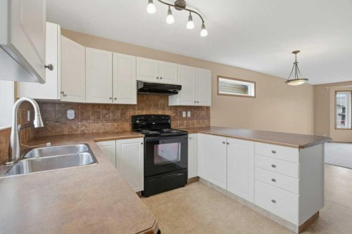 36 Keen Crescent, Red Deer, AB - Indoor Photo Showing Kitchen With Double Sink