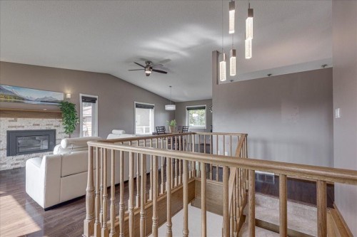 3908 39 Street Close, Ponoka, AB - Indoor Photo Showing Other Room With Fireplace