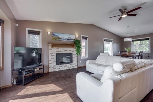 3908 39 Street Close, Ponoka, AB - Indoor Photo Showing Living Room With Fireplace