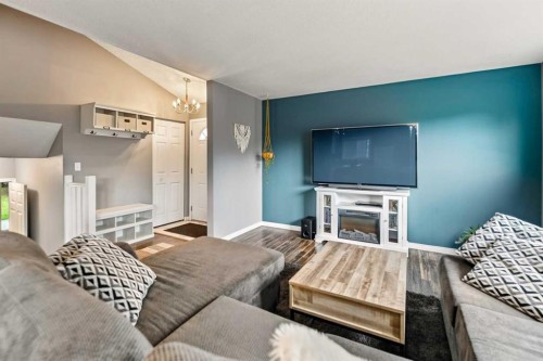 12 Opal Close, Lacombe, AB - Indoor Photo Showing Bedroom With Fireplace