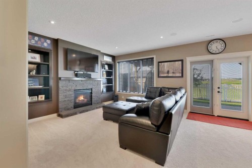 146 Sutherland Close, Red Deer, AB - Indoor Photo Showing Living Room With Fireplace