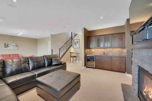 146 Sutherland Close, Red Deer, AB - Indoor Photo Showing Living Room With Fireplace