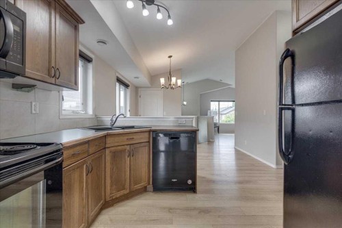 13 Rogers Road, Sylvan Lake, AB - Indoor Photo Showing Kitchen With Double Sink