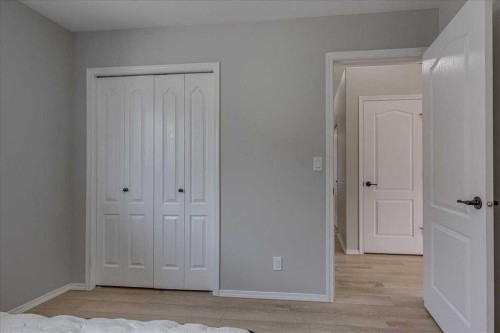 13 Rogers Road, Sylvan Lake, AB - Indoor Photo Showing Bedroom
