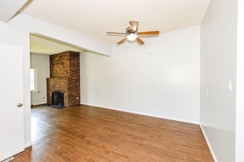 88-Mount Pleasant Drive, Camrose, AB - Indoor Photo Showing Other Room With Fireplace