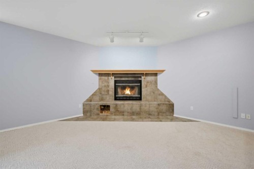 5508 49 Avenue, Alix, AB - Indoor With Fireplace