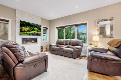74 Lazaro Close, Red Deer, AB - Indoor Photo Showing Living Room With Fireplace