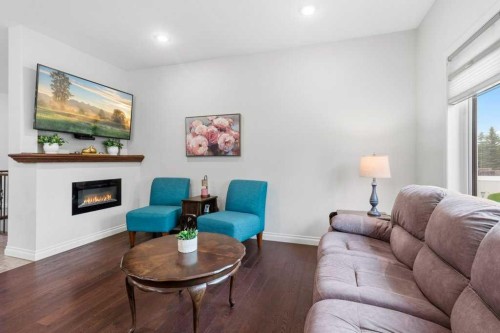 4112 45 Avenue, Sylvan Lake, AB - Indoor Photo Showing Living Room With Fireplace