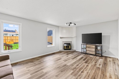 171 Douglas Avenue, Red Deer, AB - Indoor Photo Showing Living Room With Fireplace