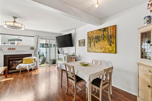 24-6300 Orr Drive, Red Deer, AB - Indoor Photo Showing Dining Room With Fireplace