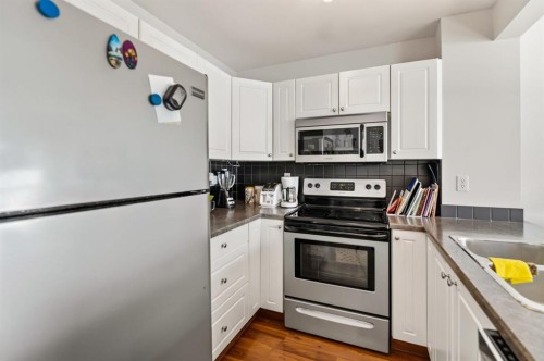24-6300 Orr Drive, Red Deer, AB - Indoor Photo Showing Kitchen With Stainless Steel Kitchen With Double Sink