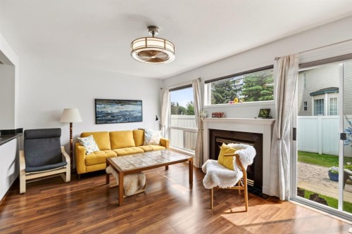 24-6300 Orr Drive, Red Deer, AB - Indoor Photo Showing Living Room With Fireplace