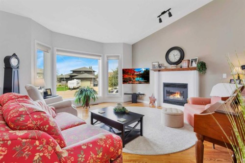 8 Pritchard Close, Sylvan Lake, AB - Indoor Photo Showing Living Room With Fireplace