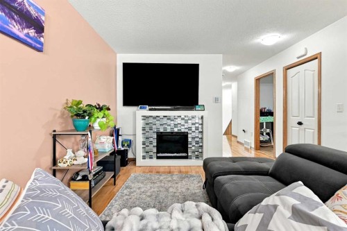118 Oak Drive, Red Deer, AB - Indoor Photo Showing Living Room With Fireplace