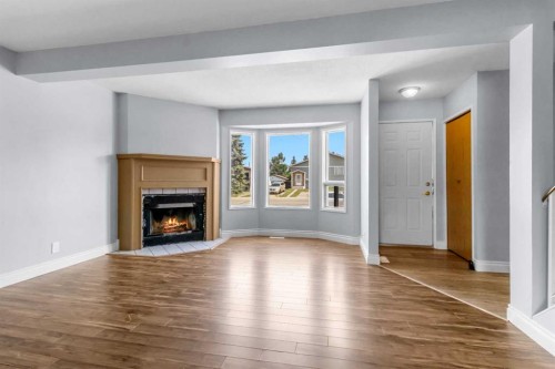 204 Northey Avenue, Red Deer, AB - Indoor Photo Showing Living Room With Fireplace
