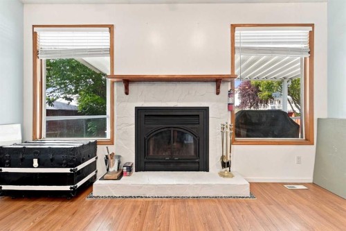 206 Davison Drive, Red Deer, AB - Indoor Photo Showing Living Room With Fireplace