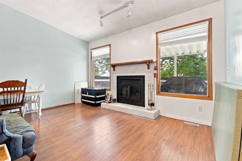 206 Davison Drive, Red Deer, AB - Indoor Photo Showing Living Room With Fireplace