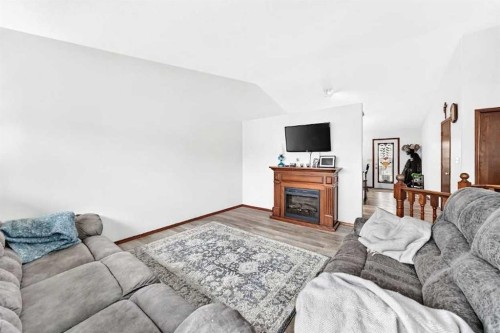 13 Westglen Boulevard, Blackfalds, AB - Indoor Photo Showing Living Room With Fireplace