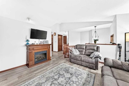 13 Westglen Boulevard, Blackfalds, AB - Indoor Photo Showing Living Room With Fireplace